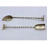 Silver spoon on shovel on elongated twisted handle and stand, hallmarked for London 1997 and by