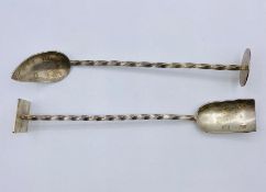 Silver spoon on shovel on elongated twisted handle and stand, hallmarked for London 1997 and by