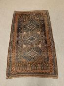 A brown ground carpet/rug (142cm x 85cm)