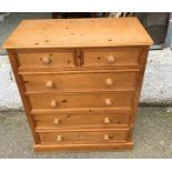 A pine two over four chest of drawers (H121cm W96cm D45cm)