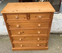 A pine two over four chest of drawers (H121cm W96cm D45cm)