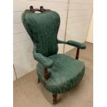 A Victorian salon chair on flute legs and castors