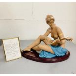 A large boxed Lladro porcelain figure of a semi-clad seated lady playing a lute 'Scheherazade No.