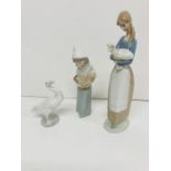 Three Lladro china figures and a swan
