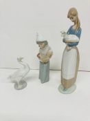 Three Lladro china figures and a swan