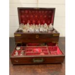 A George II brass banded perfumery box, the fitted interior with glass flasks with stoppers