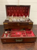 A George II brass banded perfumery box, the fitted interior with glass flasks with stoppers