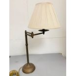 A brass table lamp with swing arm.