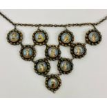 A MUGHAL necklace in white metal with ten miniature portraits.