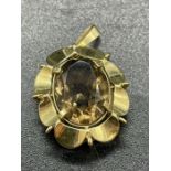 A 9ct gold pendant with smoky quartz stone. (6.6g)