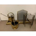 A selection of brass fire screens and tools
