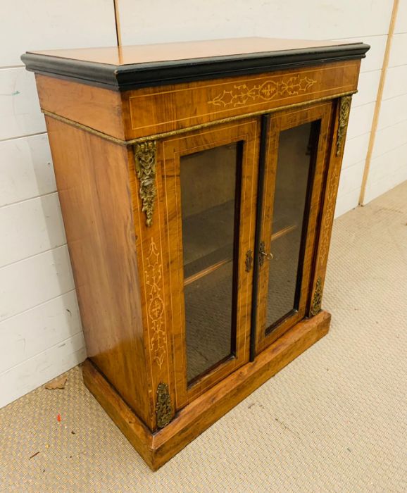 A Mahogany side cabinet with glazed doors to a single shelf, with string inlay and gilt. (60cm x - Image 3 of 3