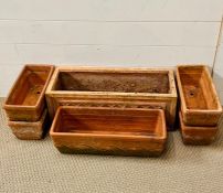 Terracotta troughs with moulded design & one with lattice pattern