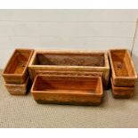 Terracotta troughs with moulded design & one with lattice pattern