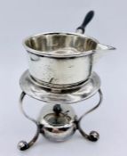A small silver sauce boat on ebonised handle with warmer by Atkin Brothers, hallmarked for 1936