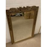 A contemporary wall mirror with carved wheat detail to top (77cm x 118cm)