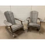 Two wooden slat garden rocking chairs (H92cm W97cm D77cm)