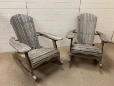 Two wooden slat garden rocking chairs (H92cm W97cm D77cm)