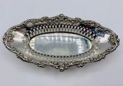 A pierced silver bonbon dish, hallmarked for London 1908, by Robert Pringle & Sons