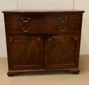 A secretary's chest with panel front doors and bracket feet (H112cm W126cm D56cm)