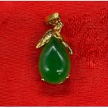 An 18ct gold and Jade pendant
