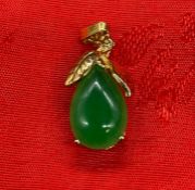 An 18ct gold and Jade pendant