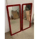 A pair of wall mirrors in red and oriental theme gilding to sides (110cm x 46cm)