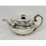 A Georgian silver teapot with indistinct hallmarks (545g)