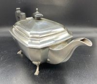 A silver teapot on four hoof feet, total weight 805g, hallmarked for Birmingham by A E Poston & Co