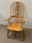 A pine wheel back style kitchen chair