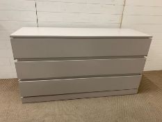 A light grey three drawer chest with soft closing drawers (H80cm W150cm D50cm)