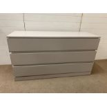 A light grey three drawer chest with soft closing drawers (H80cm W150cm D50cm)