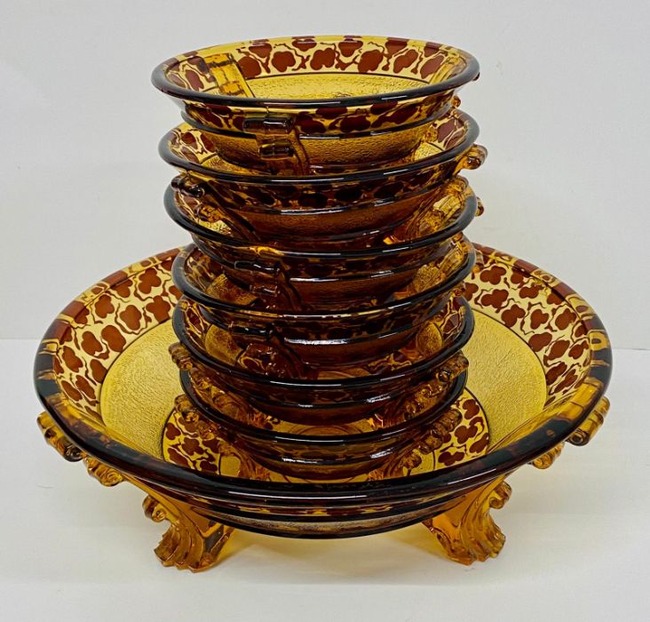 Amber and brown large glass serving bowl and six small dishes