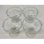 Four glass dishes with twisted stem