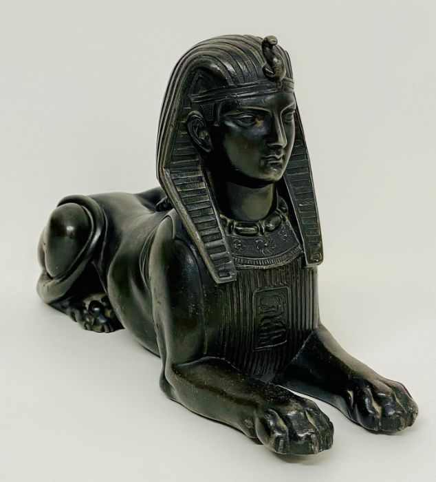 A cast metal figure of the Sphinx