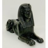 A cast metal figure of the Sphinx