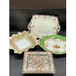 Four china decorative handed plates and side dishes