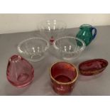 A selection of various coloured glassware