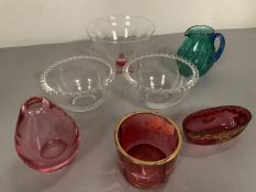 A selection of various coloured glassware