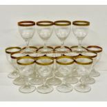Nineteen wine glasses with gilt rim
