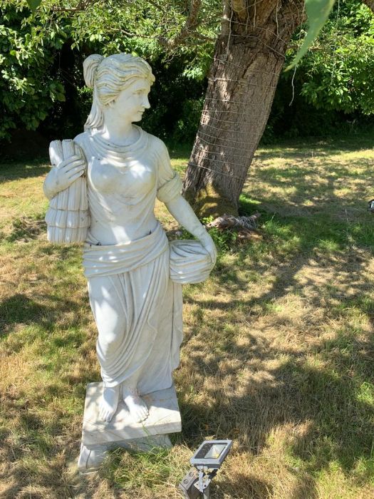 A Roman style statue of a woman 160 cm high