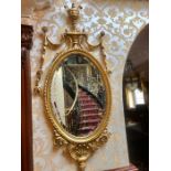 A gilt look mirror AF with swag details 128 cm high by 64 cm wide