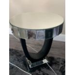 A contemporary mirrored side table (60 cm d x 70 cm h)