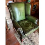 A Green wing back club chair (80cm w x 97cm h x seat height 44cm)