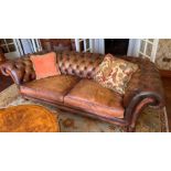 A Brown Leather Chesterfield style sofa 240 cm w x 78cm d x Seat height 44cm