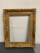A gilt frame with floral and scroll work (16 x 12 inch)