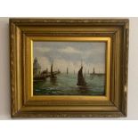 An oil on canvas of 'Sailing boats in harbour' within a gilt frame (Frame size 39x46.5cm)