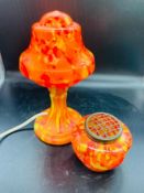 A blown glass orange lamp and rose bowl