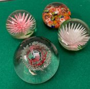 Four glass paperweights