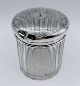 A Glass jar with hallmarked silver top for Birmingham